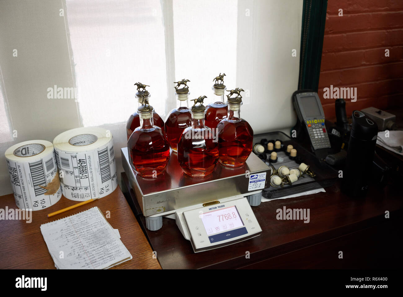 Bottles of Blanton's Bourbon being weighed in the bottling room at Buffalo Trace Distillery, Frankfort, Kentucky Stock Photo