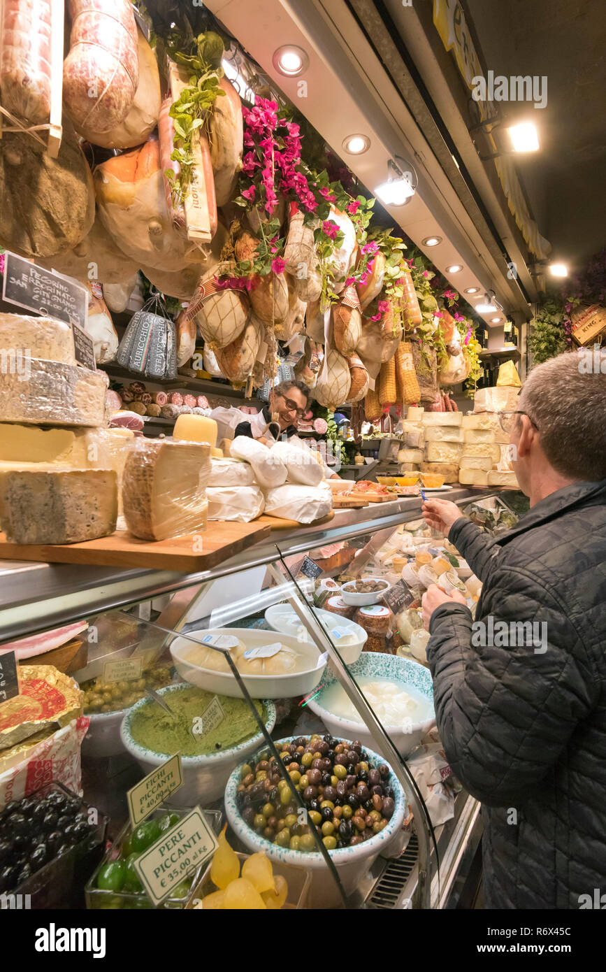 Vertical portrait of customers inside the Mercato Centrale in Florence, Italy. Stock Photo