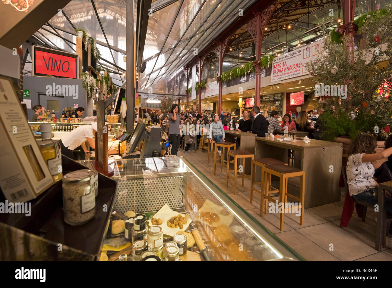 Horizontal portait of people at a food hall in Florence, Italy. Stock Photo