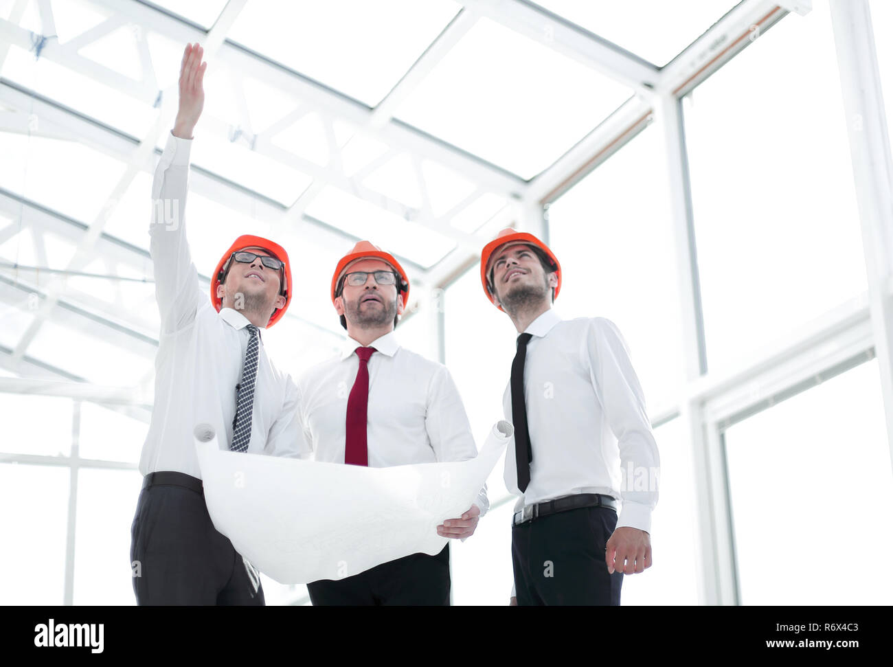 architect shows the customer a new building Stock Photo - Alamy