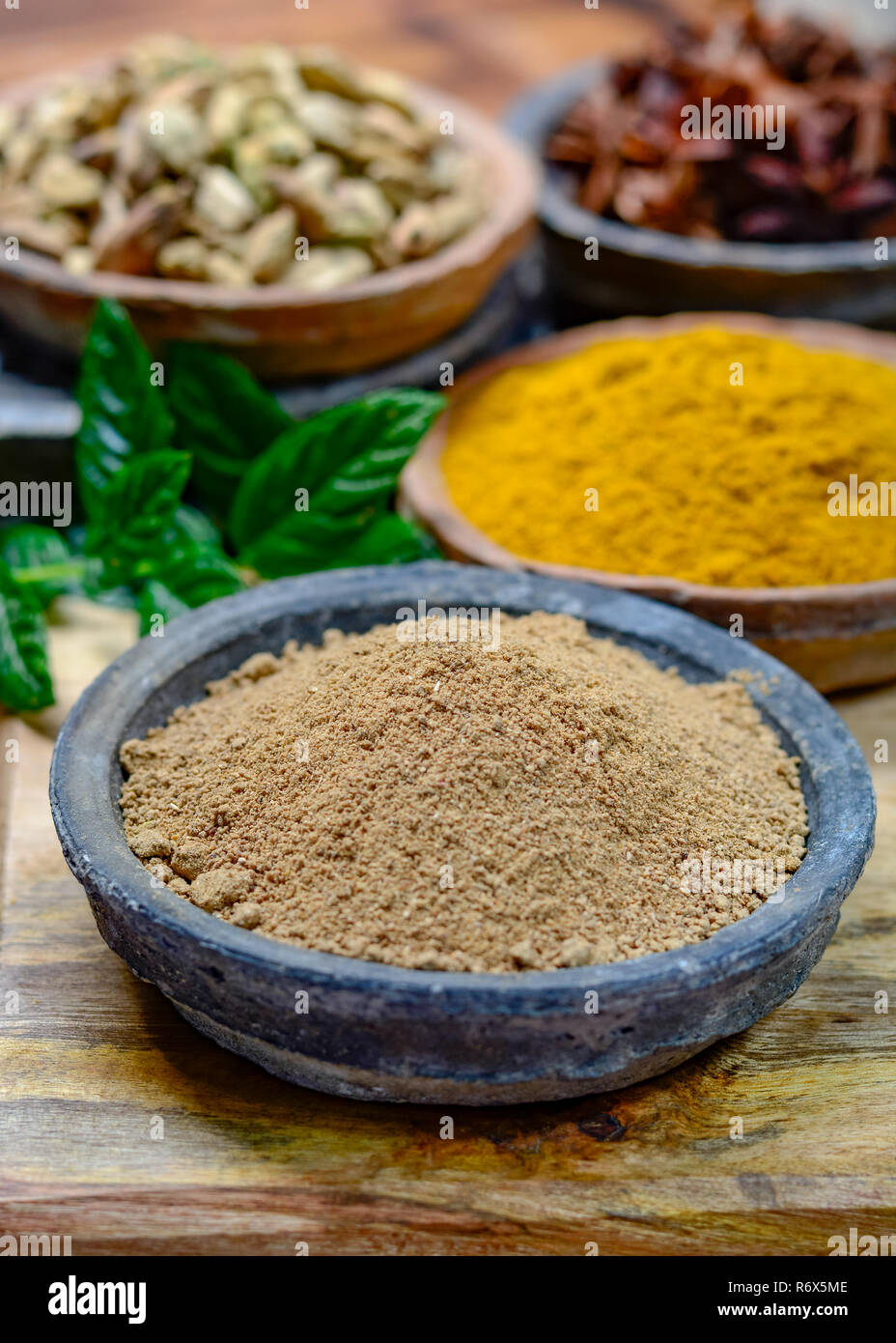 Amchoor or aamchur, mango powder, fruity spice powder made from dried unripe green mangoes in India, used to flavor foods close-up Stock Photo