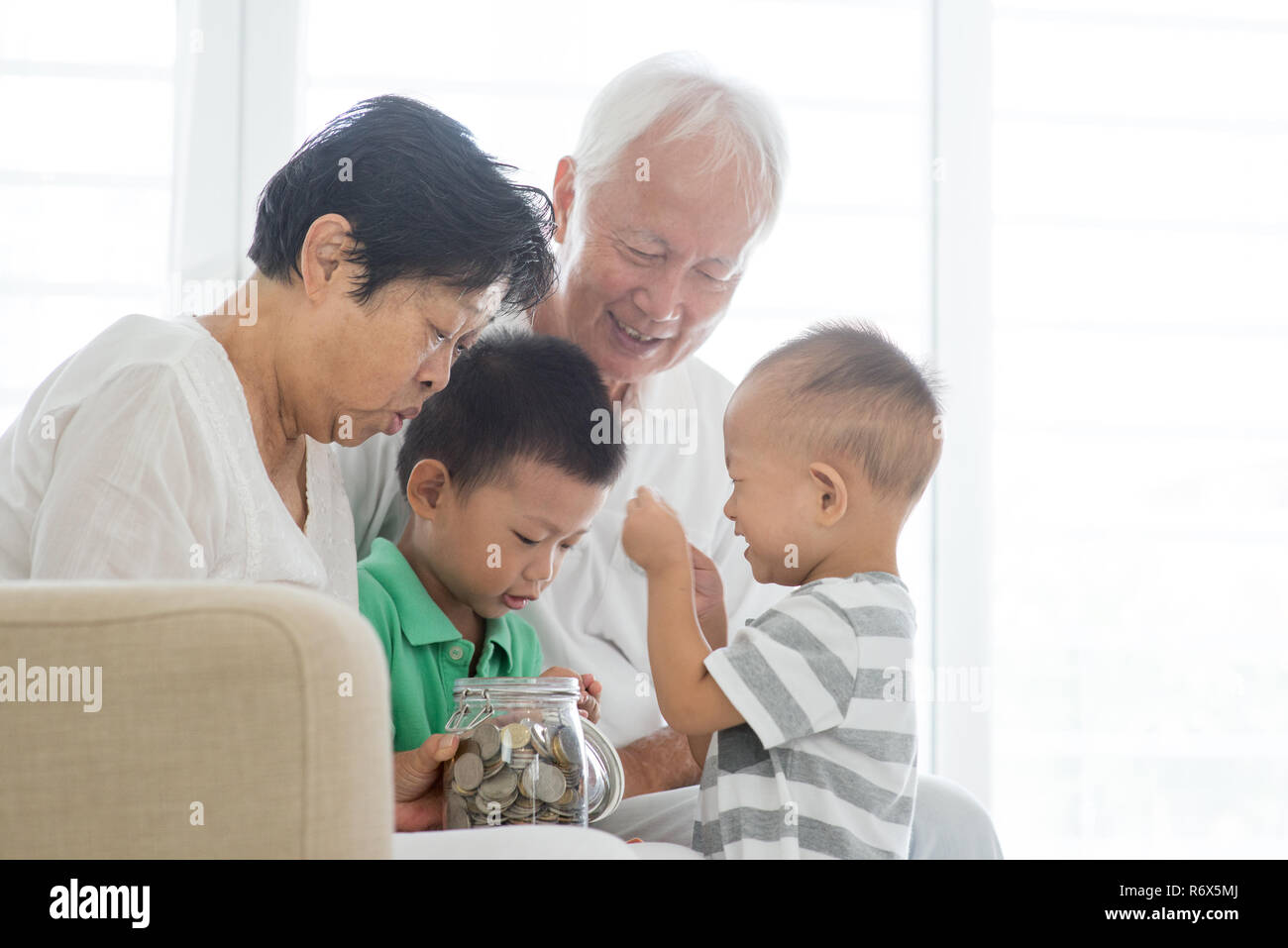 Grandchildren grandparents saving hires stock photography and images