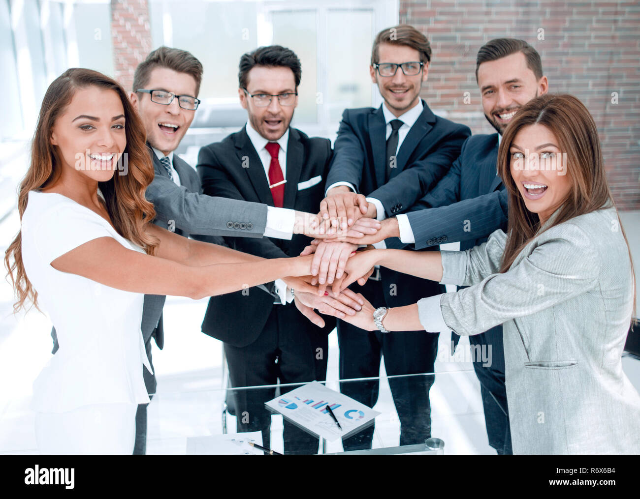 happy business team standing in office Stock Photo - Alamy