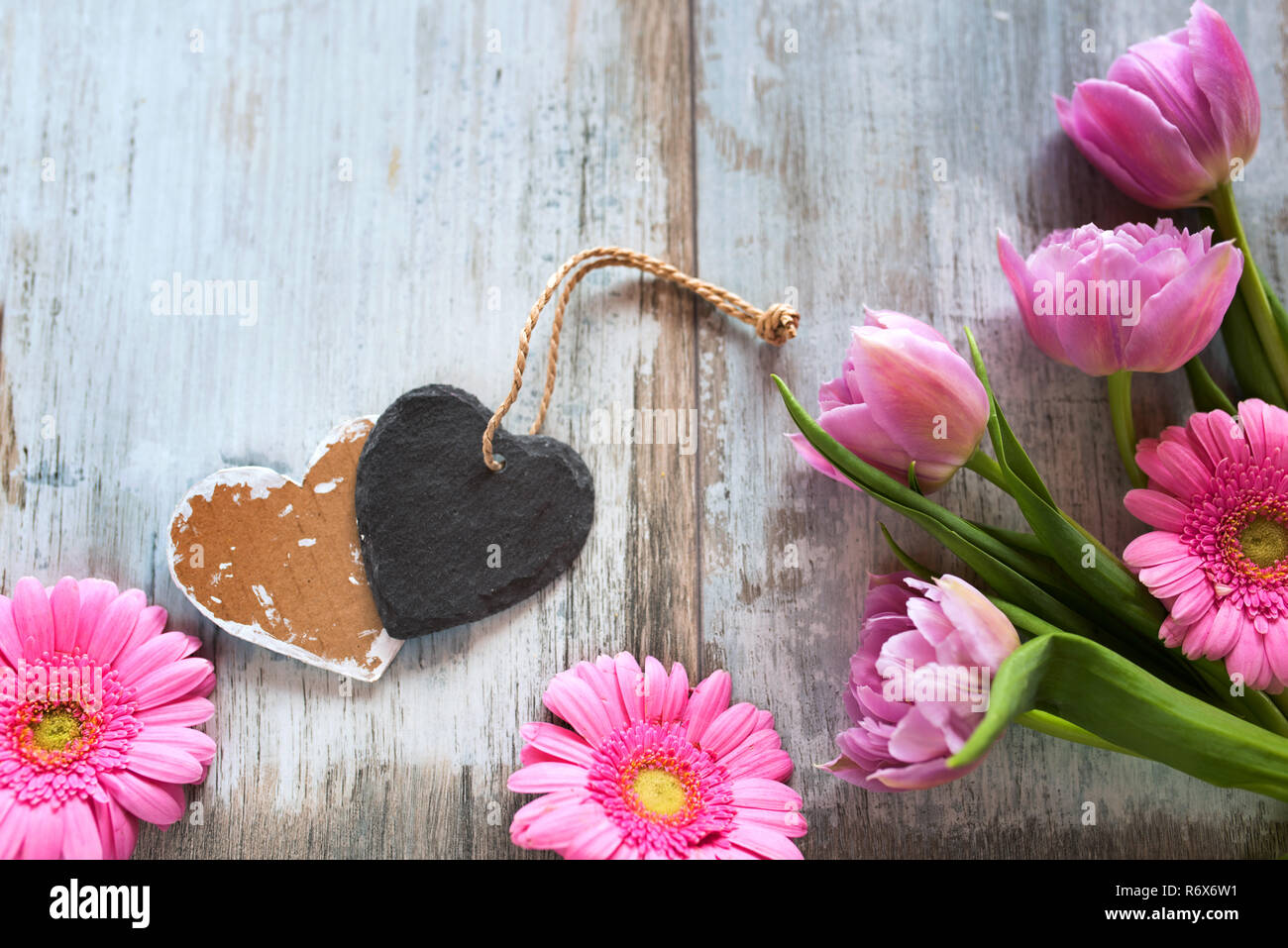 Download Spring Flowers With Hearts On Gray Vintage Planks Stock Photo Alamy