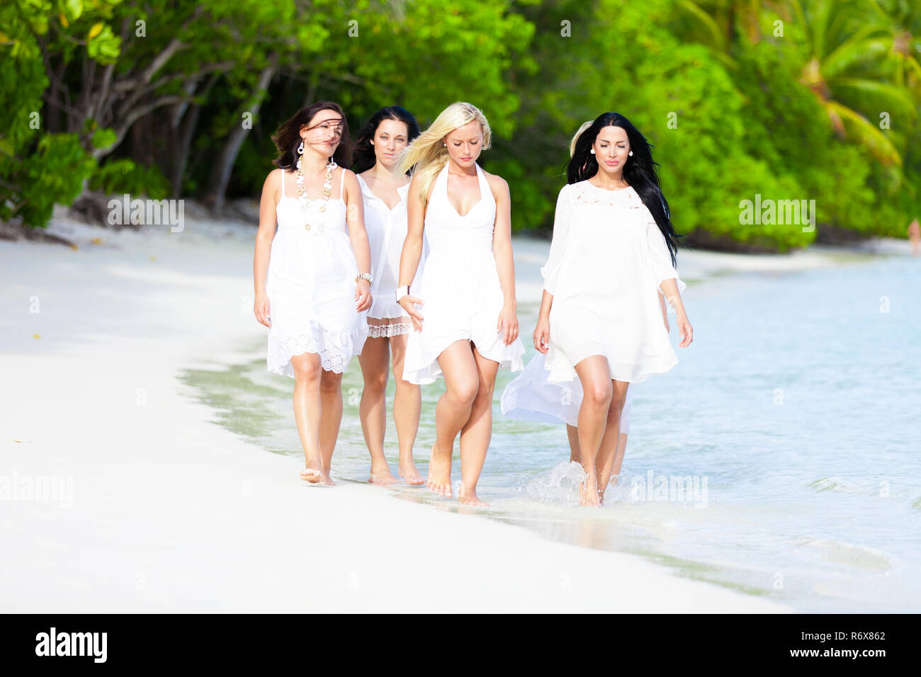 Young girl group at the beach on Maldives Stock Photo - Alamy