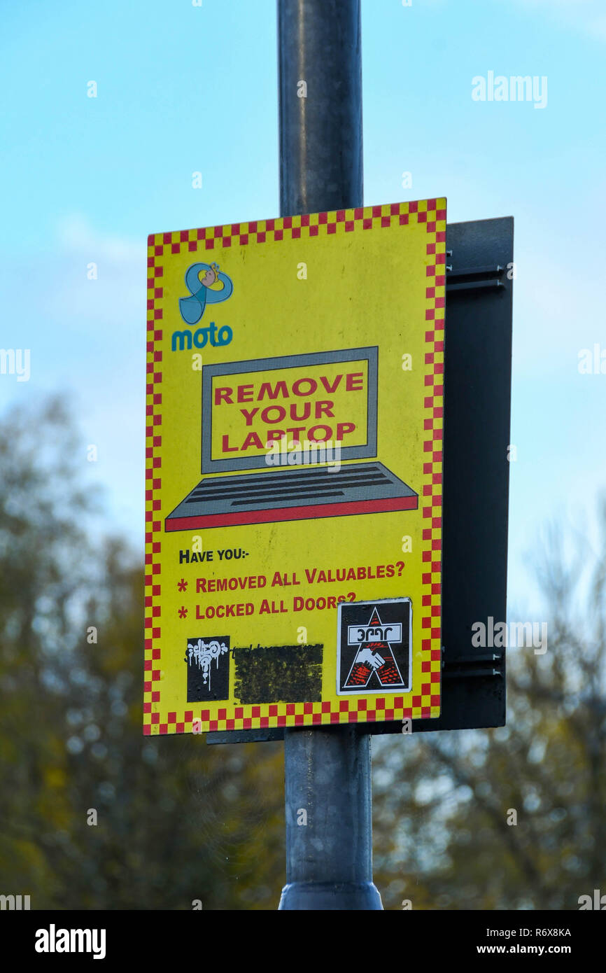 M4 SERVICES, READING, ENGLAND - NOVEMBER 2018: Sign at the M4 service station in Reading warning motorists to take care of valuables when parking Stock Photo