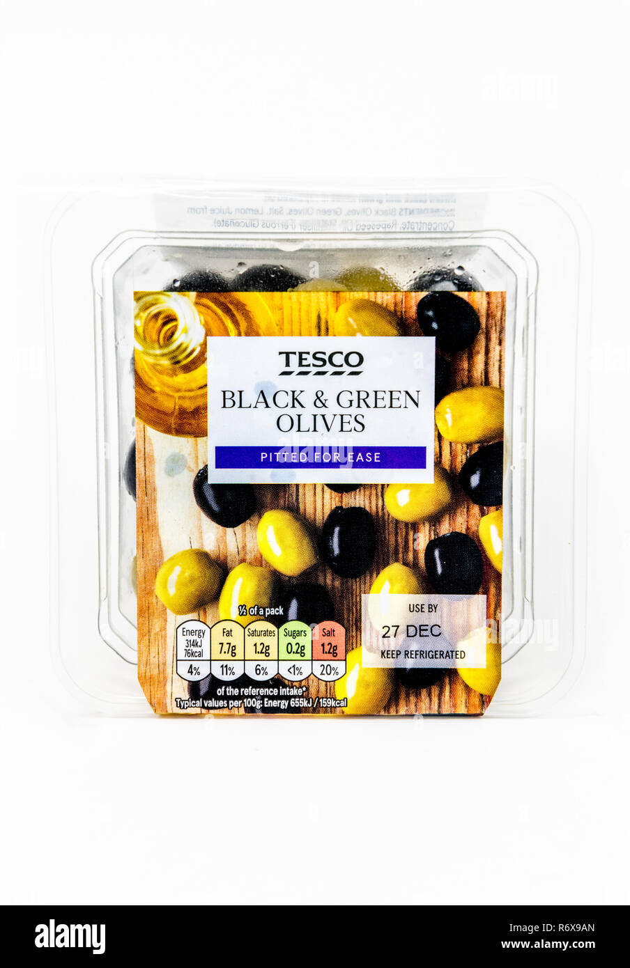 Tesco Black and Green olives in a clear single use plastic tub. Stock Photo
