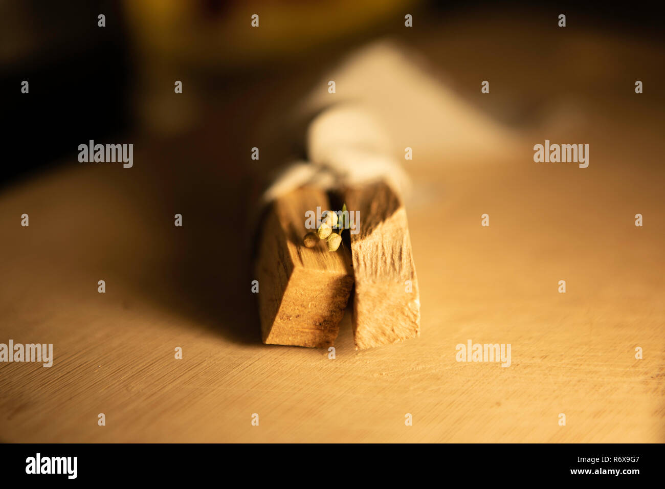 Top view of smudging sticks with dried flowers on a wooden tray Stock Photo