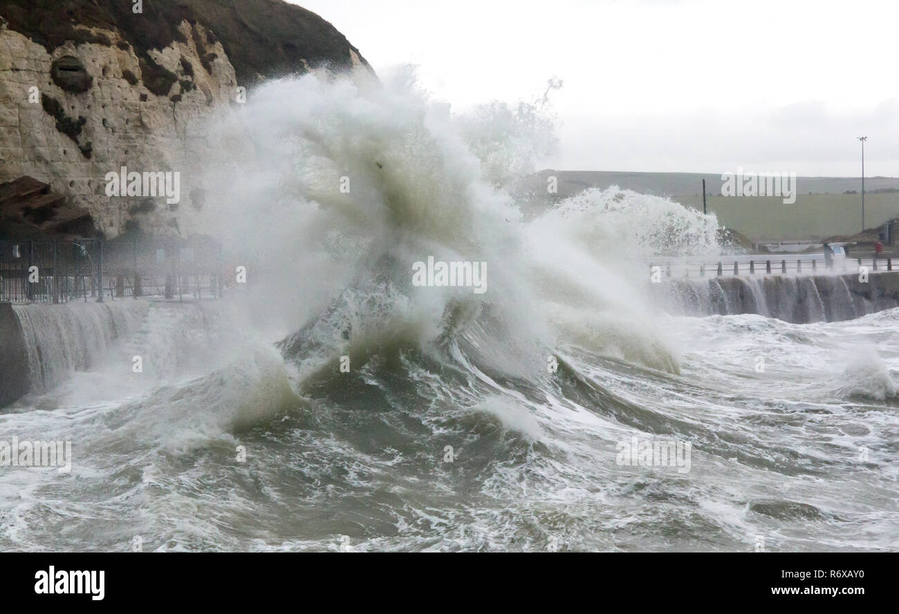 Waves and debris flung up over sea wall at Newhaven Harbour Stock Photo
