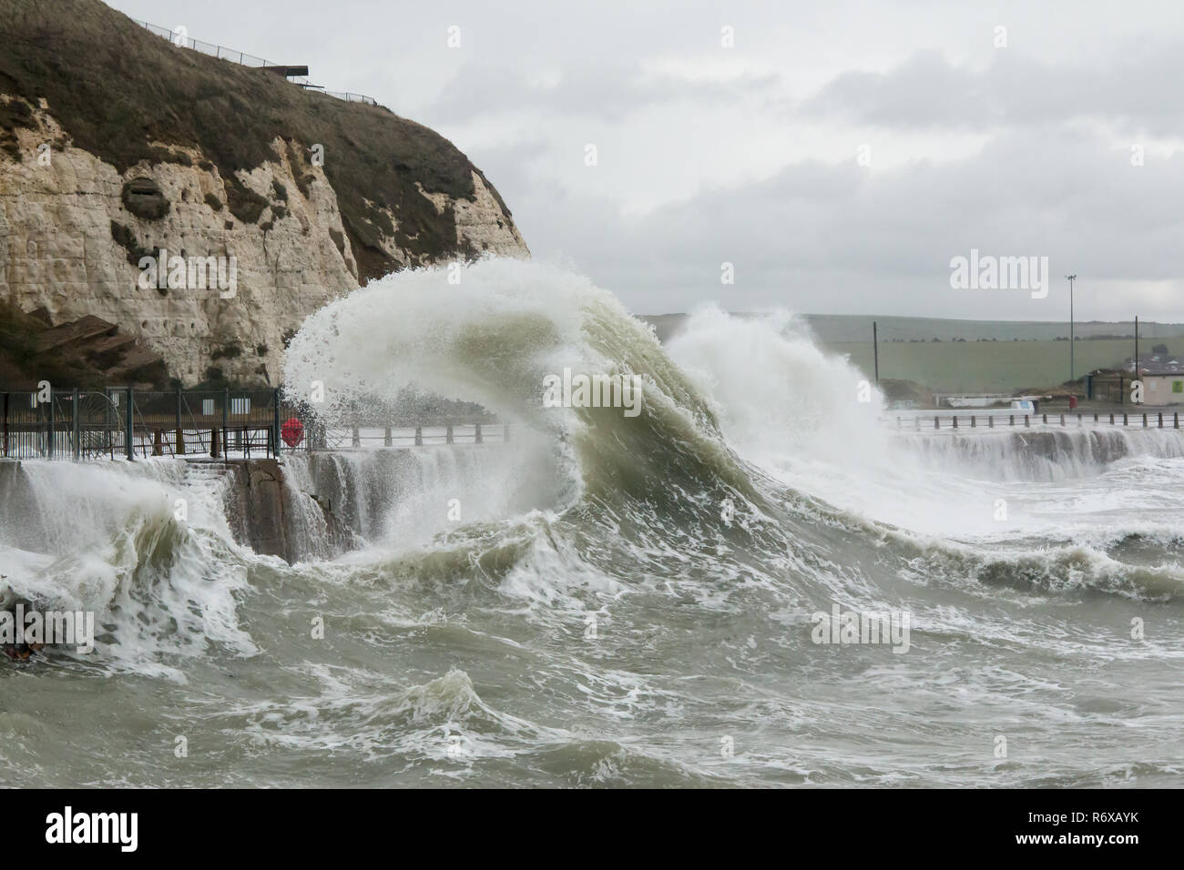 Wave curling and spray at Newhaven Harbour. Stock Photo
