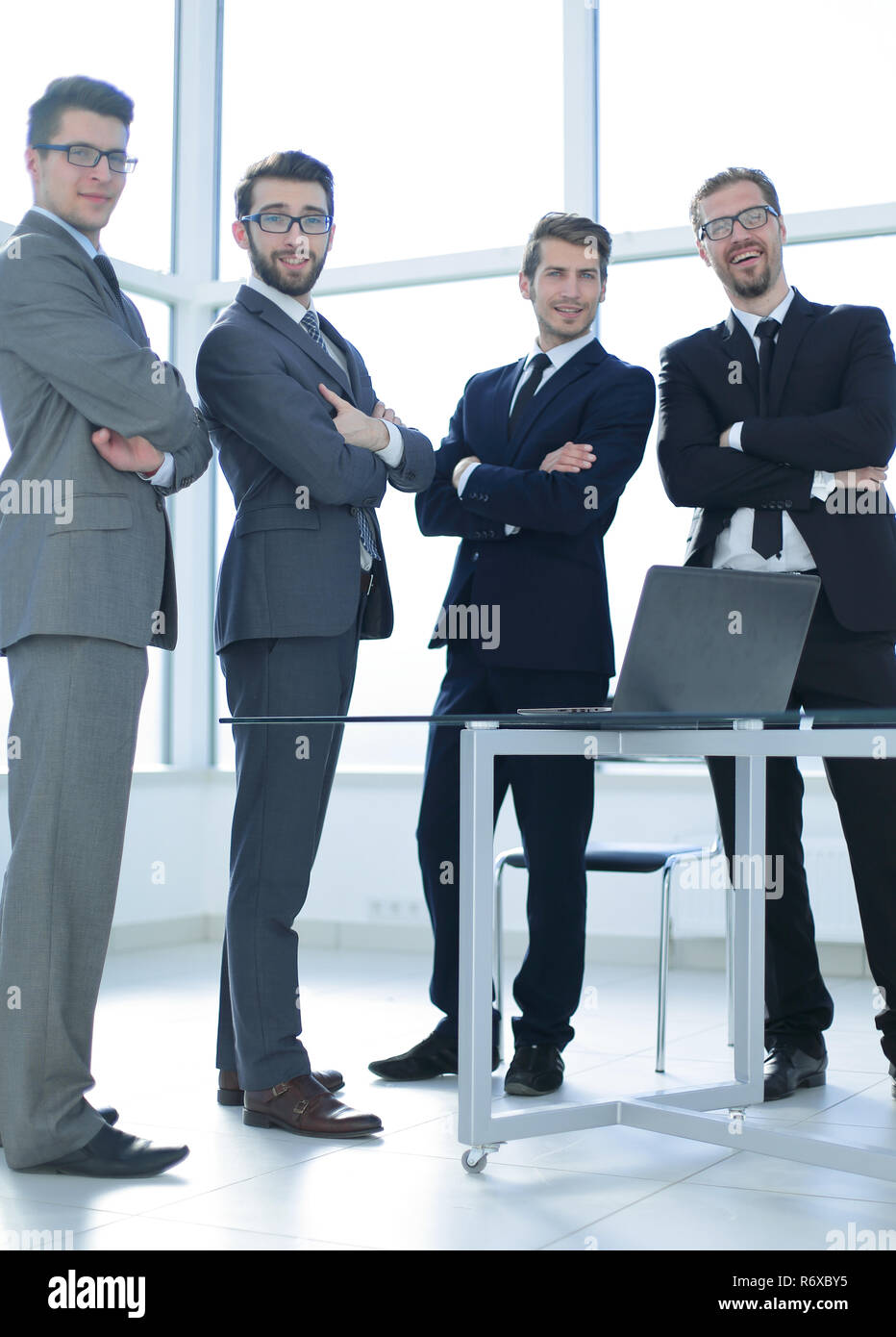 group of business people standing in the office Stock Photo - Alamy