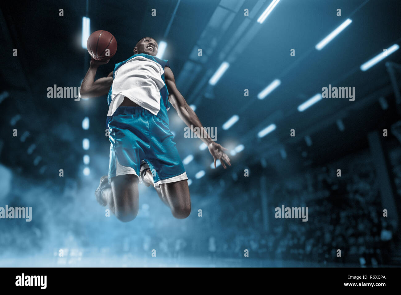 Basketball player on big professional arena during the game. Basketball