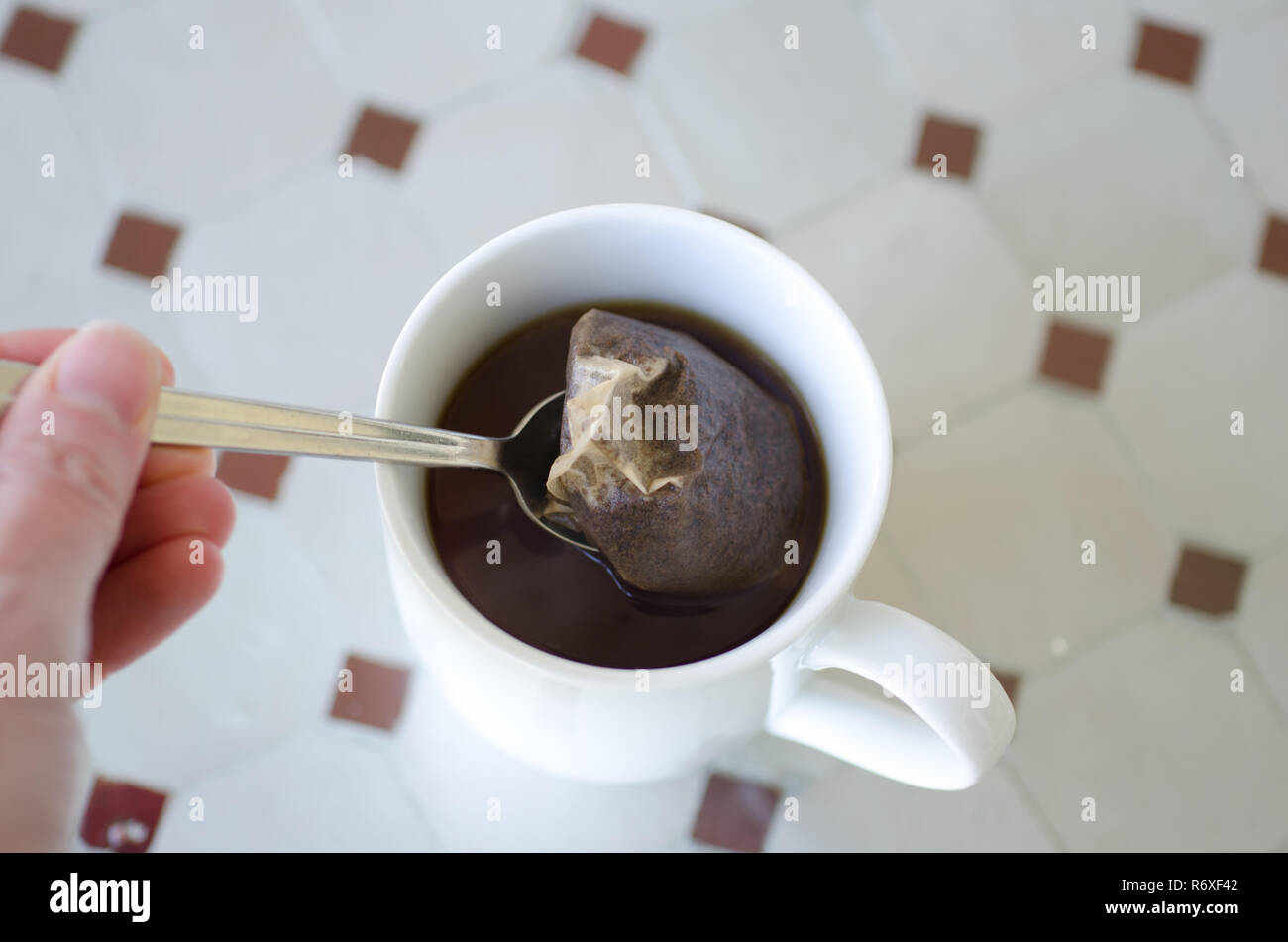 Tea with a tea bag and spoon Stock Photo Alamy