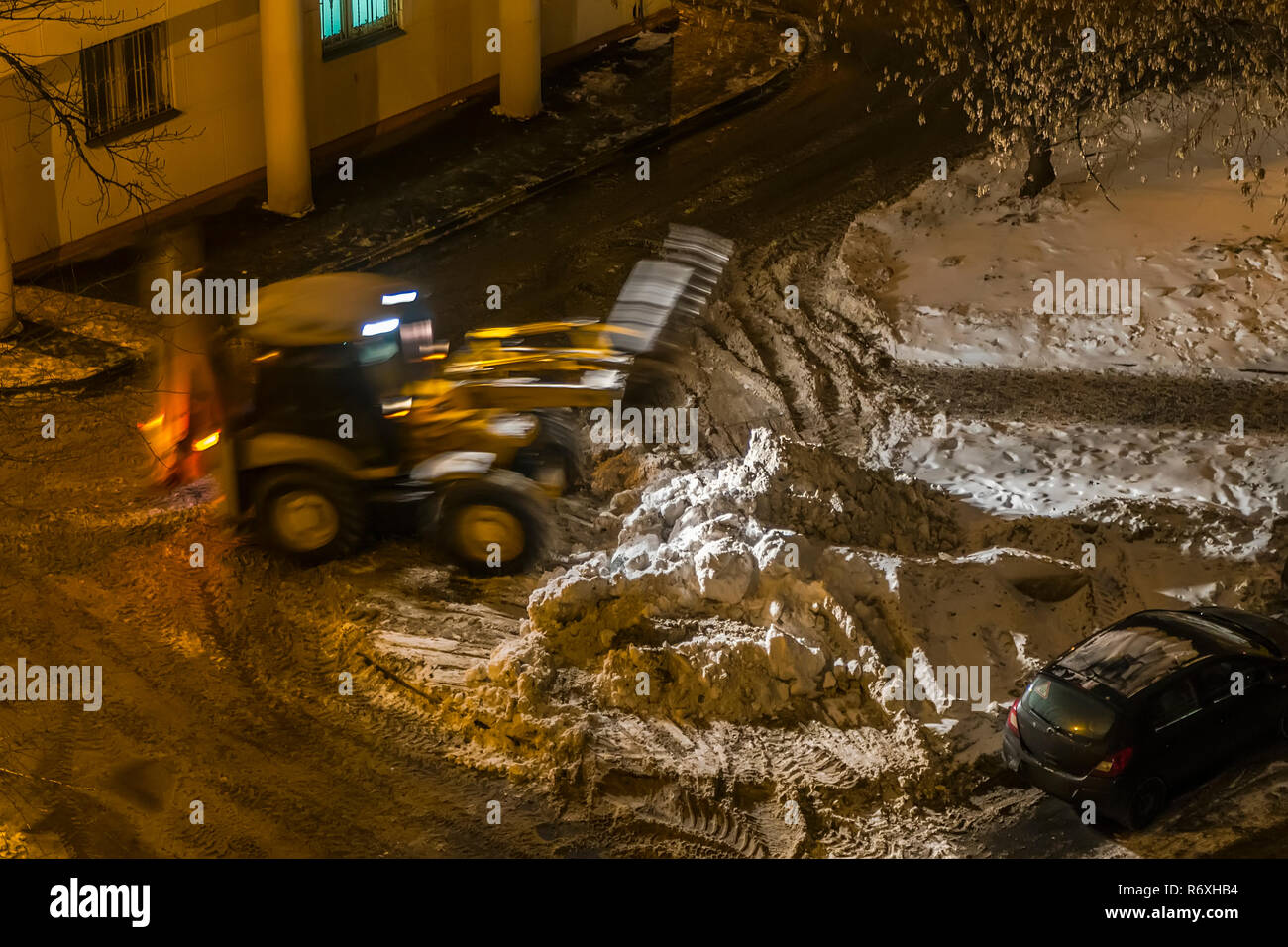 Night Snow loading by road machinery after heavy snowfall in ...