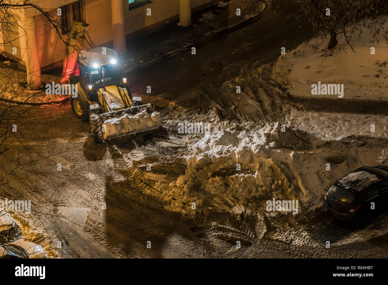 Night Snow loading by road machinery after heavy snowfall in ...