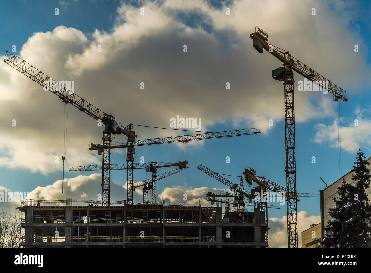 Cranes working day and night on construction of the housing estate in ...