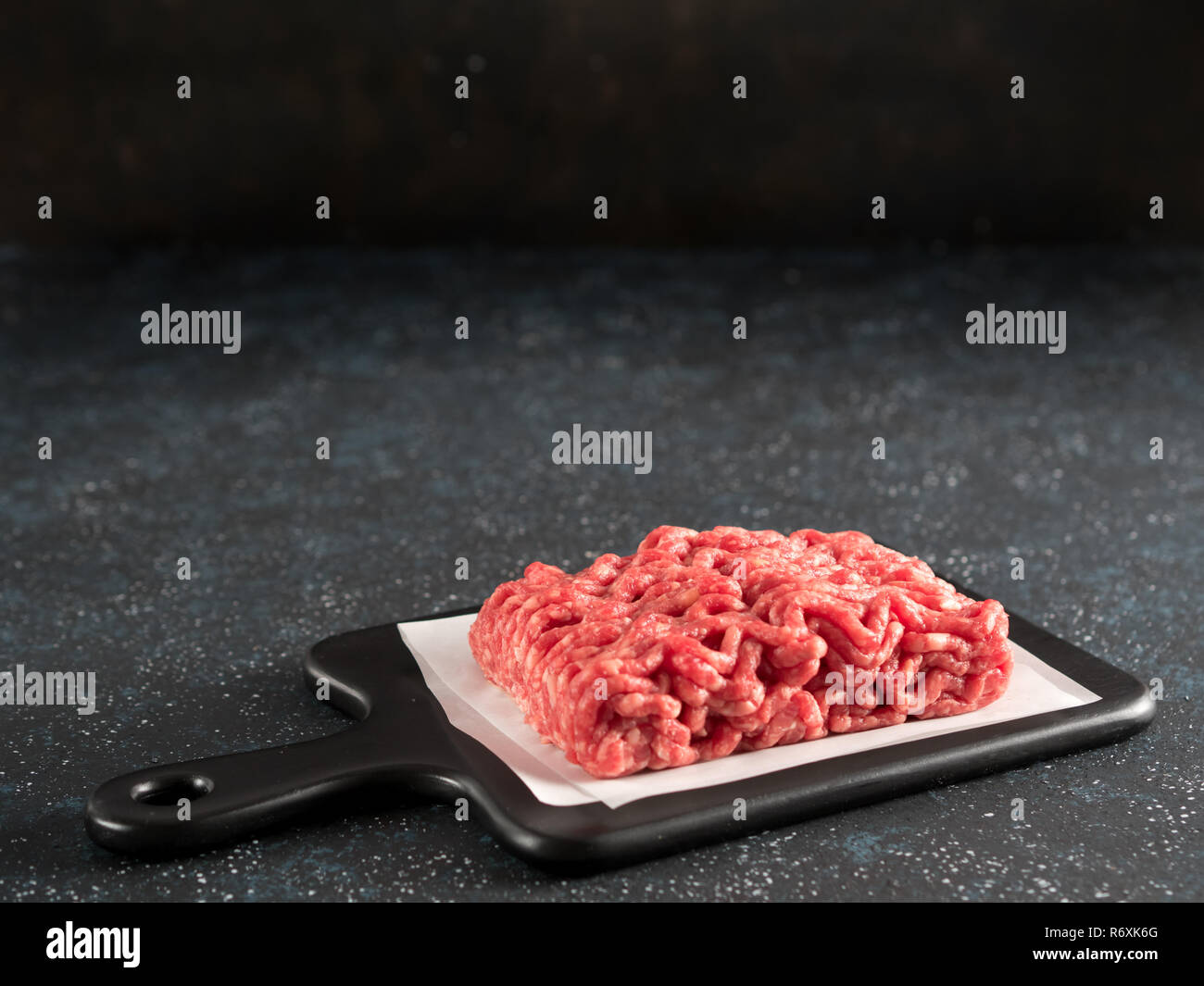 raw minced beef on light gray cement background Stock Photo Alamy
