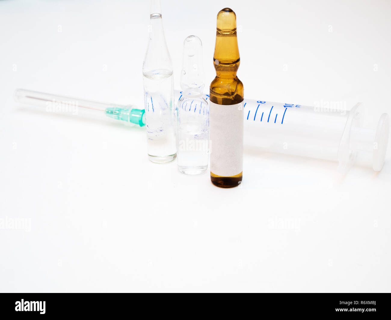 three different ampoules ampules with medicine drugs vaccines and
