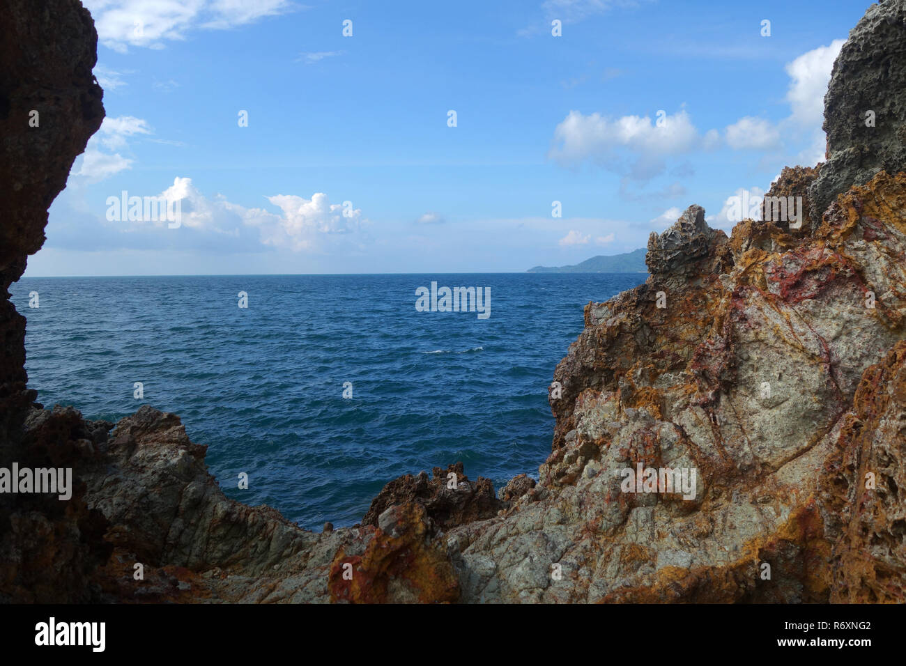 Gap in the rock over sea Stock Photo - Alamy