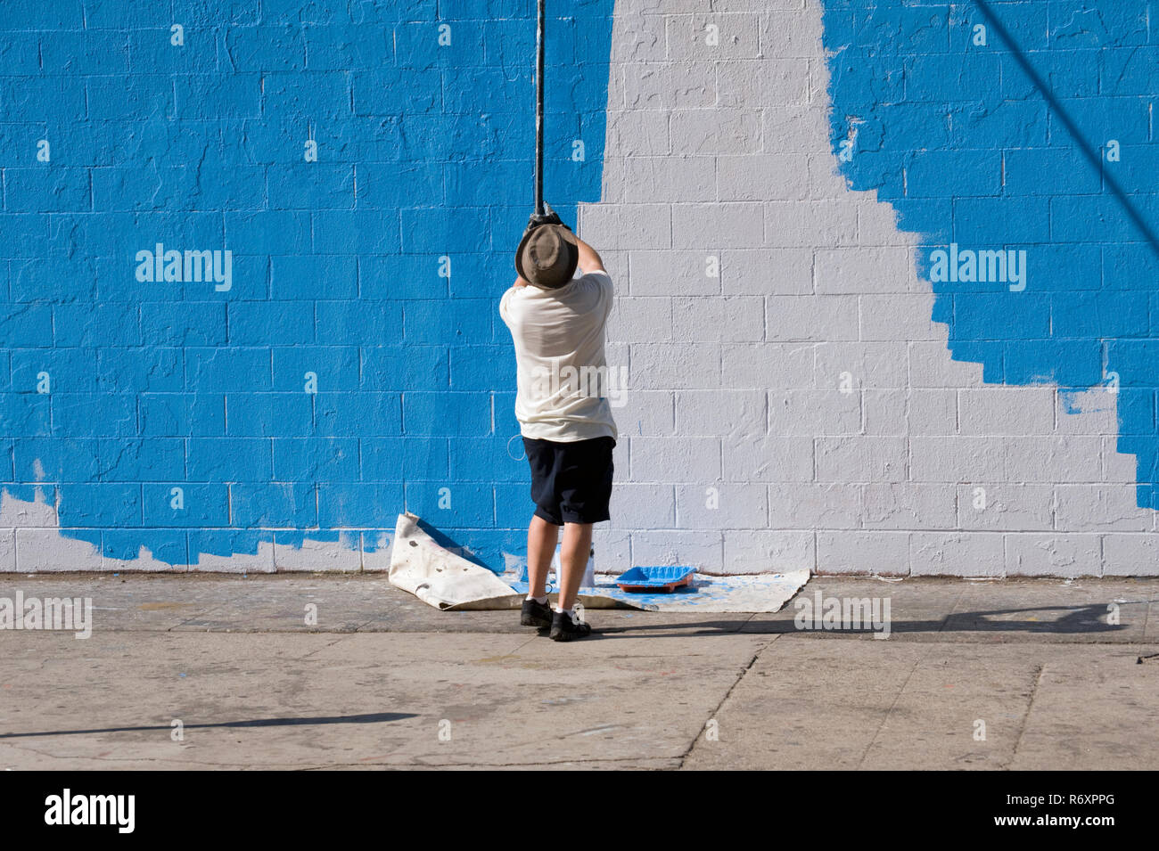 painting a white wall blue Stock Photo