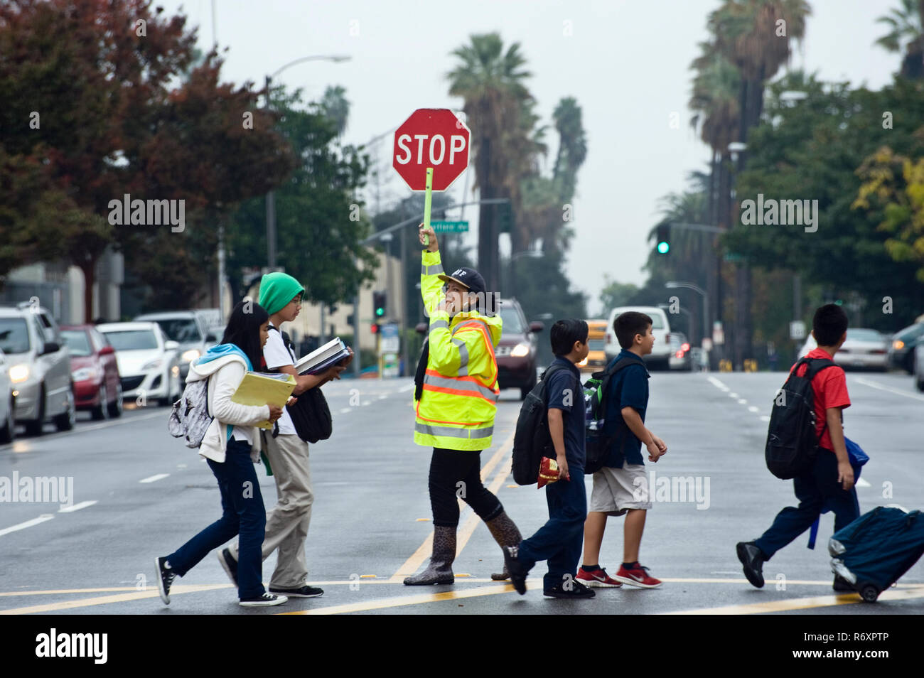 crossing guard with school children Stock Photo