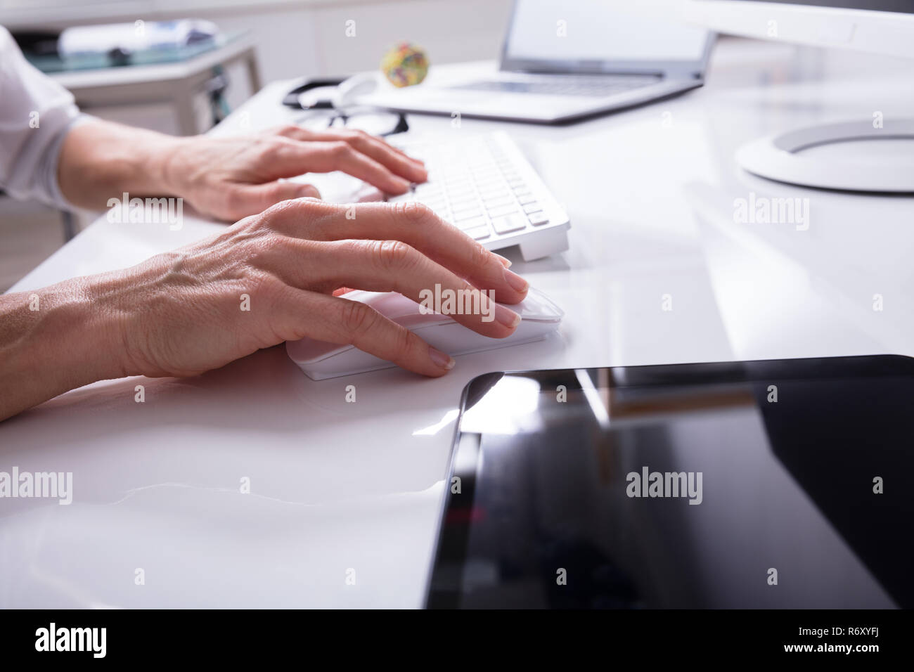 Businessperson Typing On Computer Keyboard Stock Photo