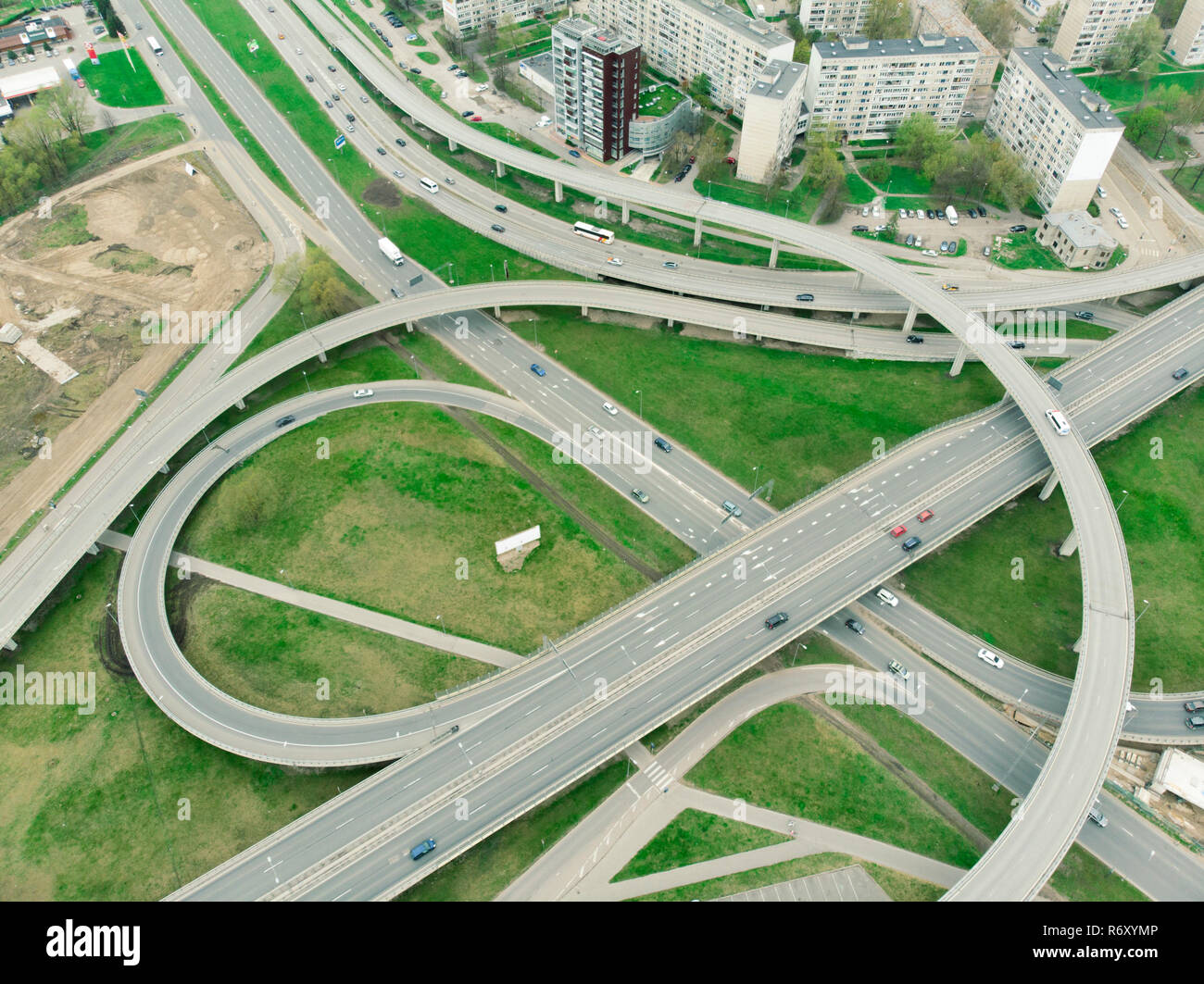 Aerial highway junction. Highway from aerial view. Urban highway and lifestyle concept. Construction of additional concrete road curve of viaduct in Riga, Latvia Stock Photo