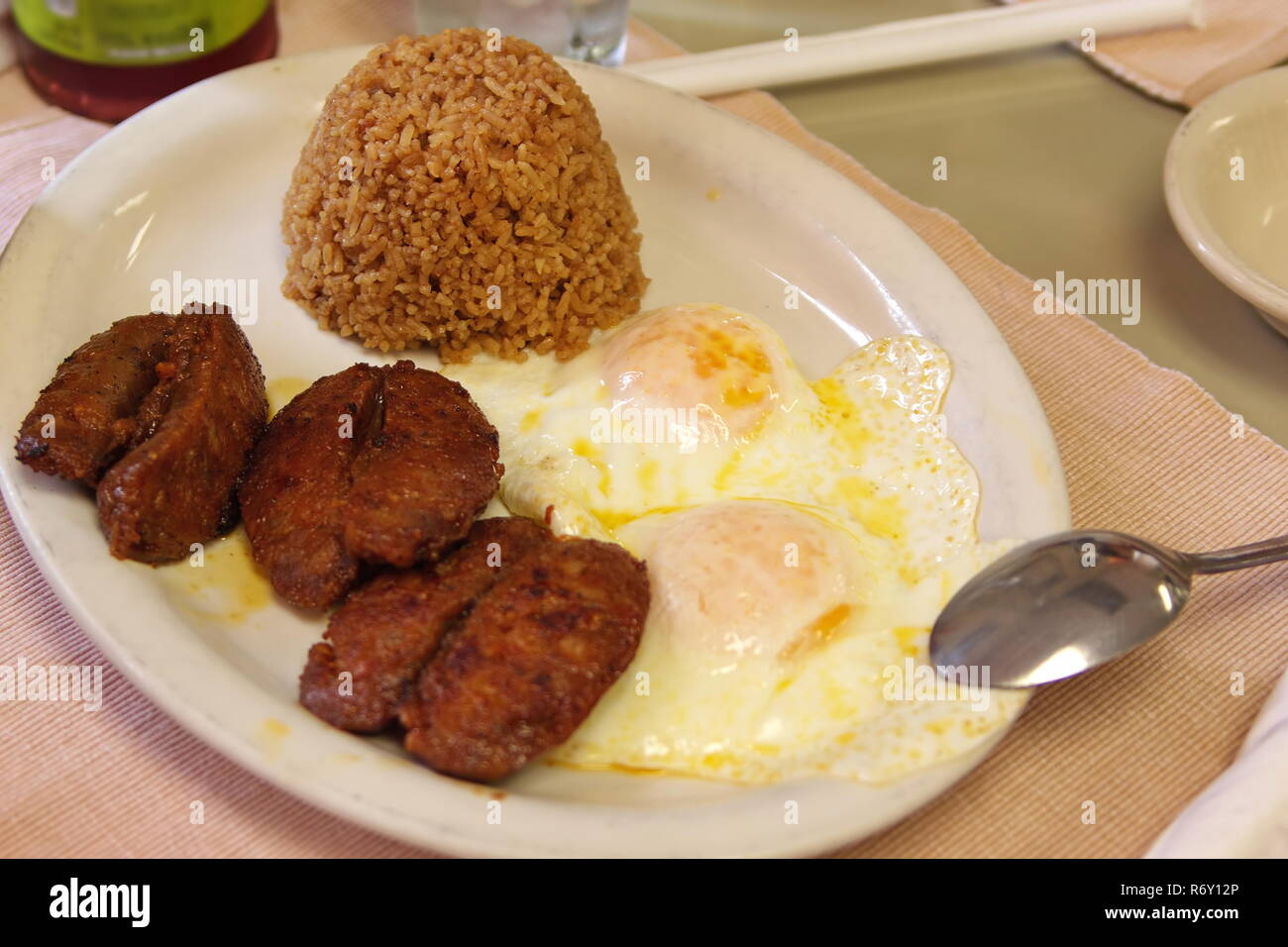 Typical Filipino breakfast of sausages, eggs, and fried rice. Stock Photo
