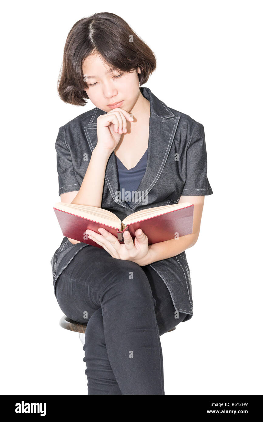 Woman reading a book sitting on chair Stock Photo - Alamy
