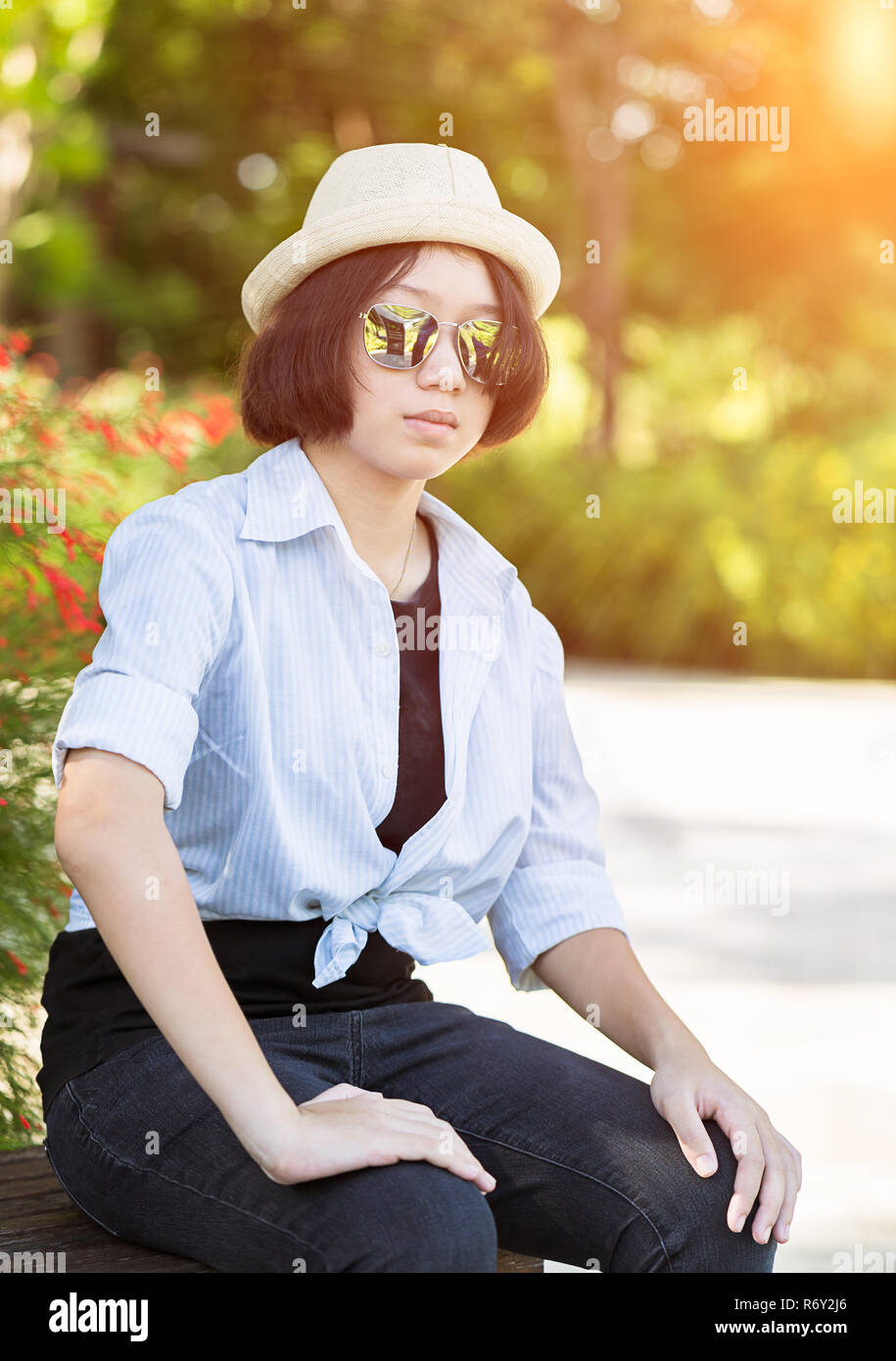 Women With Short Hair Wearing Hat In Park Stock Photo 228017502