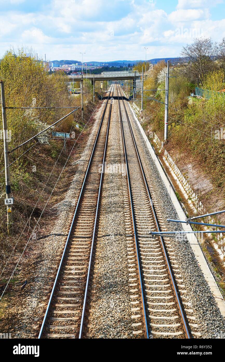 two lanes or tracks of rails meeting in perspective into one, fusion of two  rail lanes or tracks, the photo can have a symbolic meaning Stock Photo -  Alamy