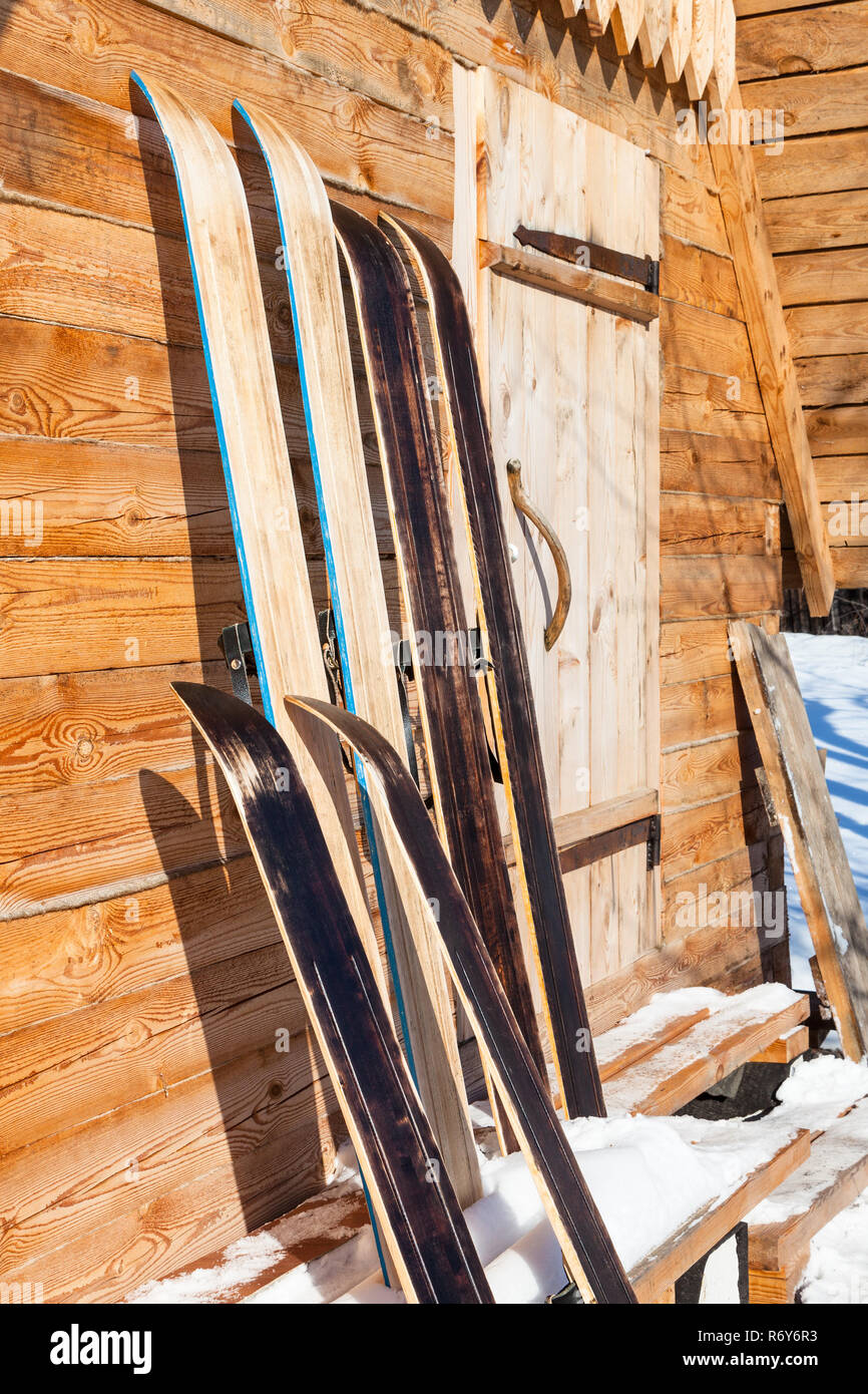wide hunting skis near wall of wooden cottage Stock Photo Alamy
