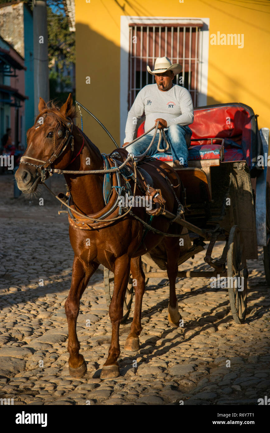 Horse drawn carriage and driver in Trinidad, Cuba. Stock Photo