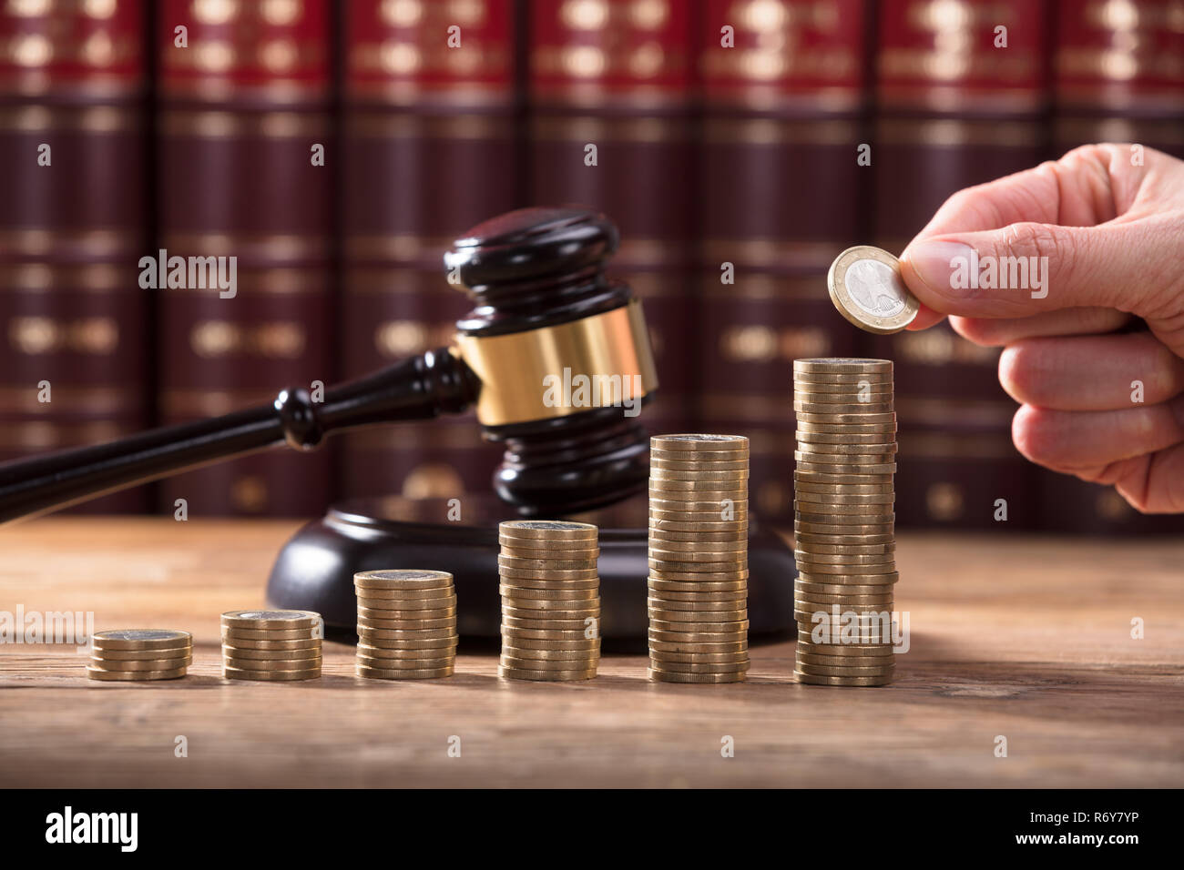 Close-up Of Human Hand Placing A Coin Stock Photo