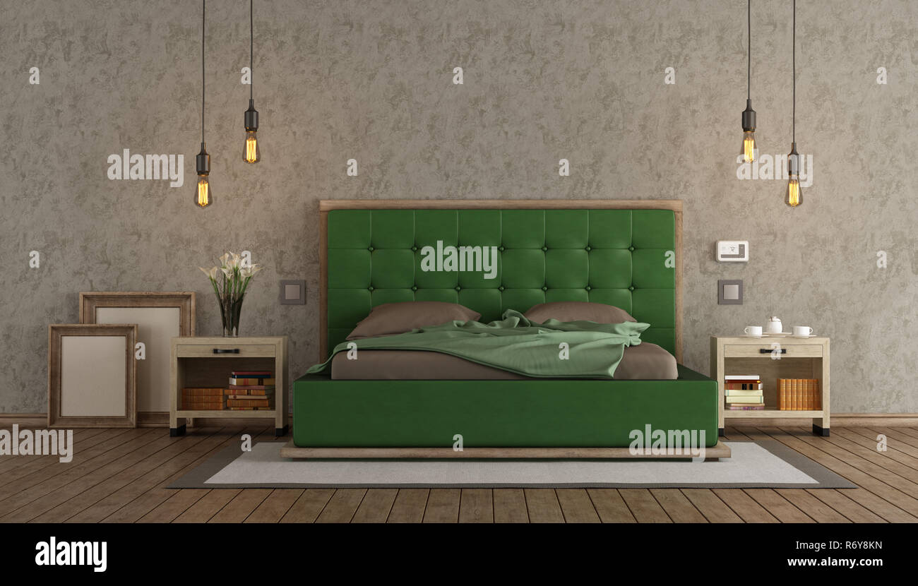 Master bedroom with green double bed Stock Photo