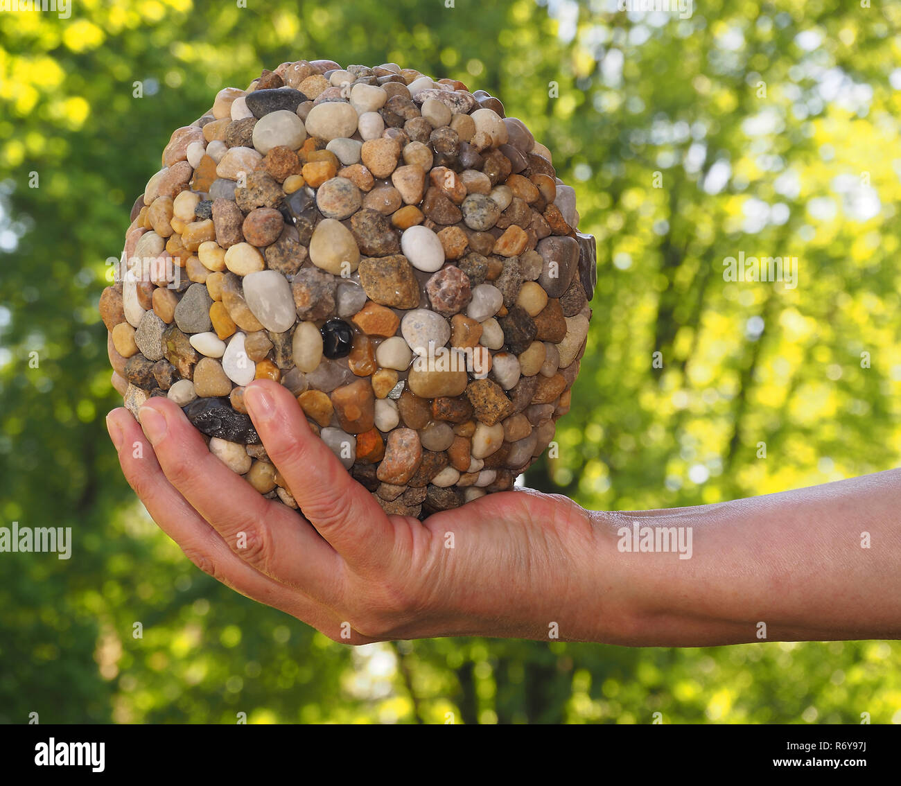 stone ball in the hand Stock Photo