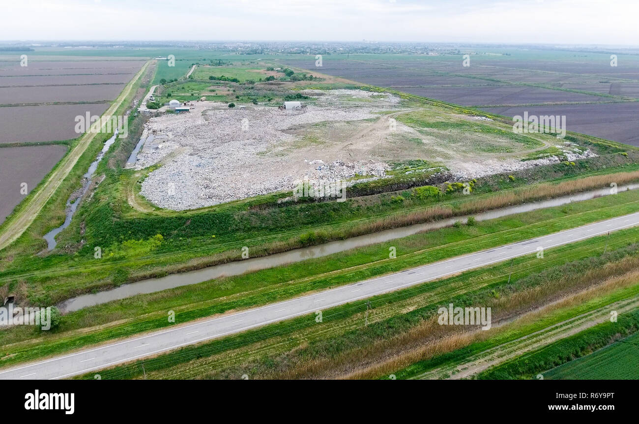 garbage dump with heaps of garbage and treatment facilities. Landfill