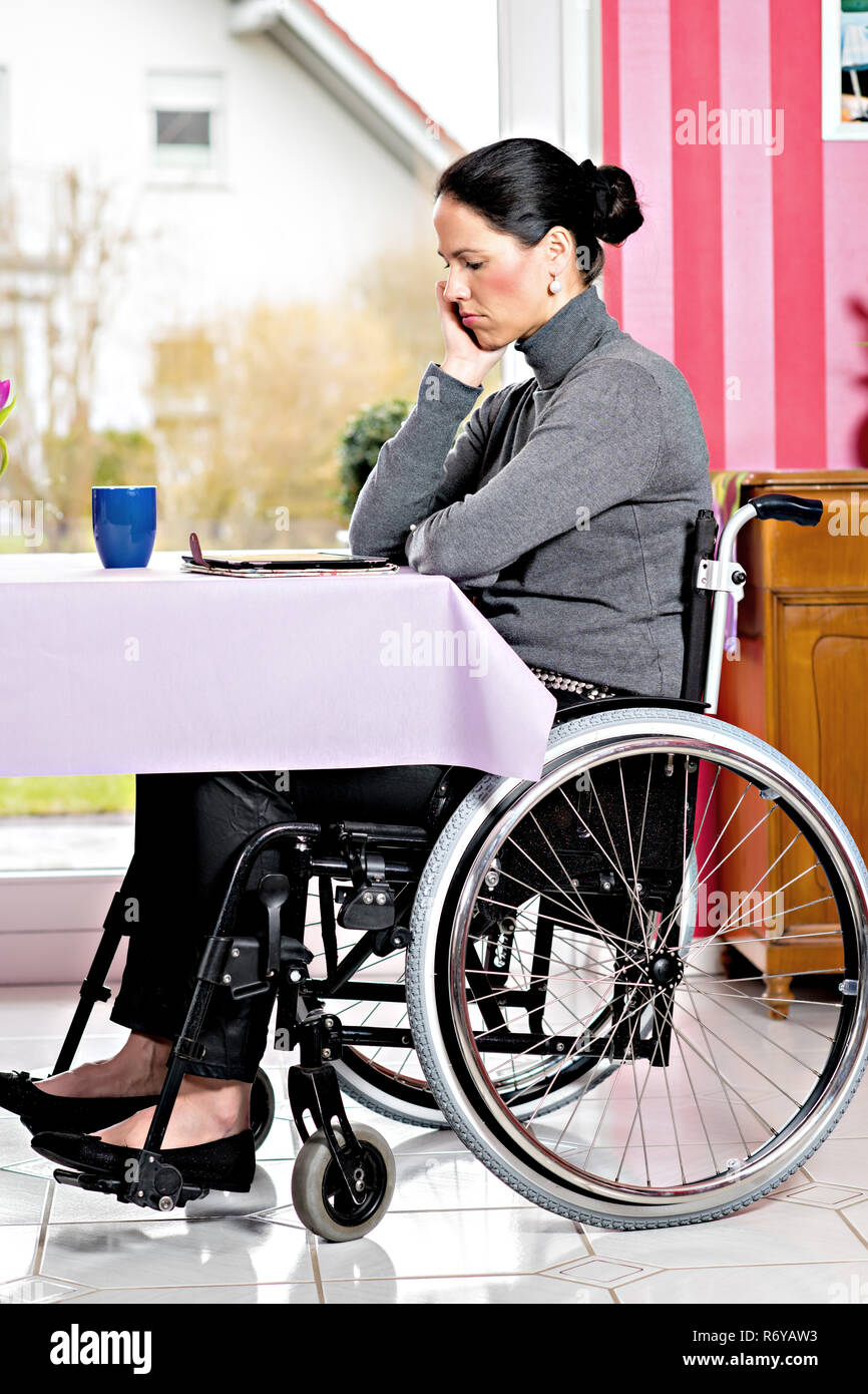 disabled woman in wheelchair with tablet PC Stock Photo - Alamy