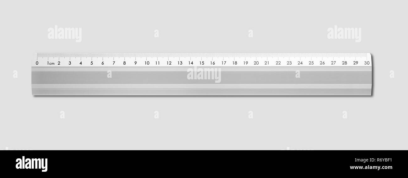 Metal ruler isolated on grey background Stock Photo
