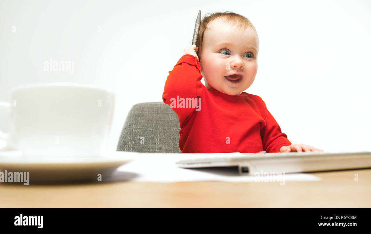 Happy child baby girl toddler sitting with keyboard of computer ...
