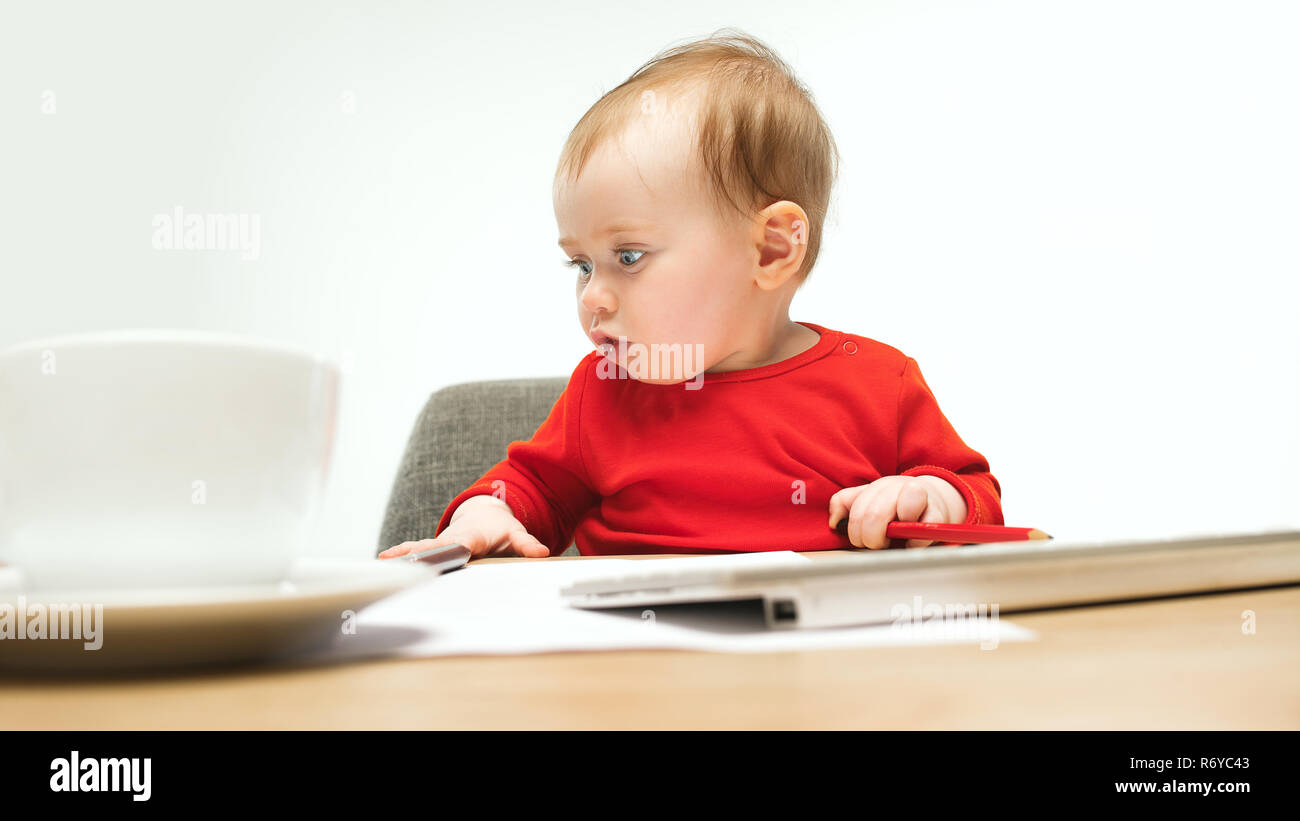 Happy child baby girl toddler sitting with keyboard of computer ...