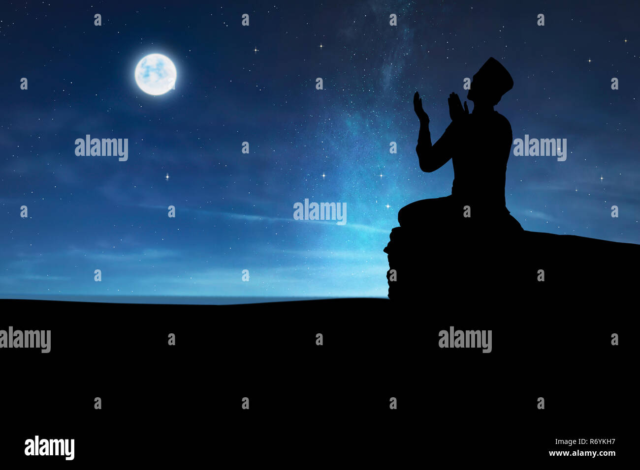 Silhouette of muslim man praying to god Stock Photo - Alamy