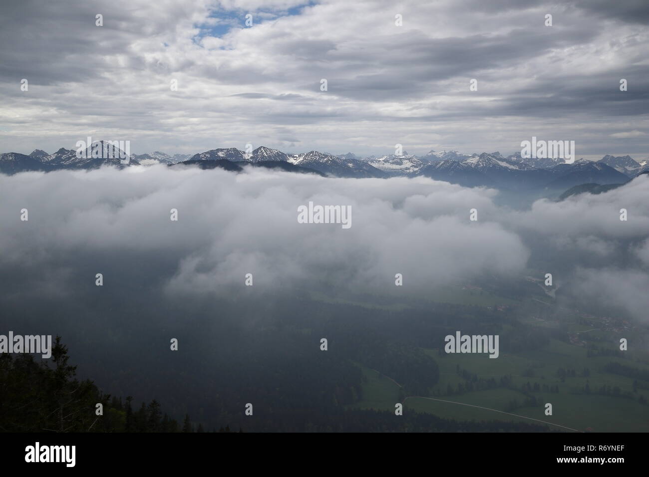 mountain peaks in the fog Stock Photo
