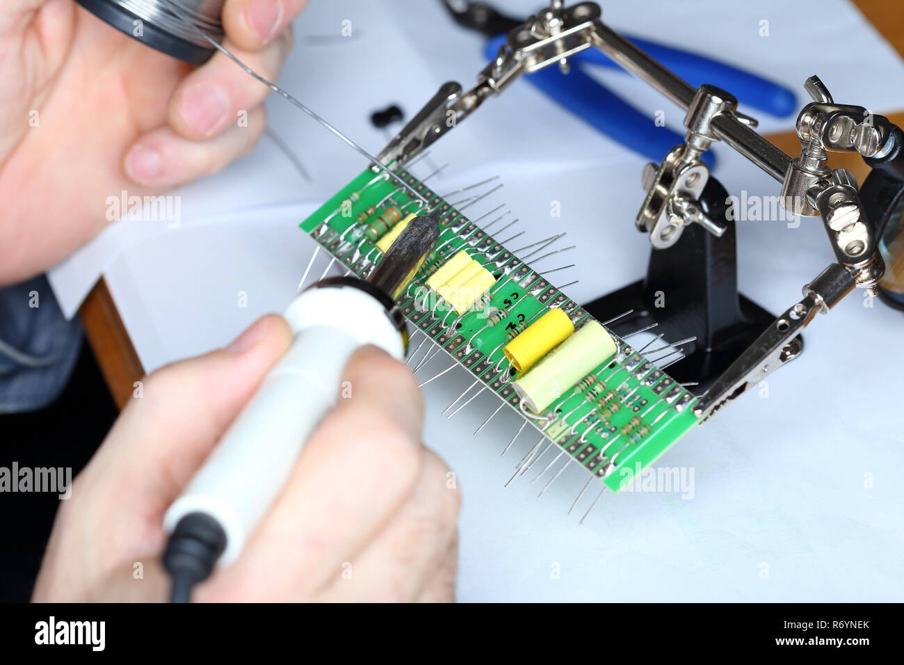 soldering on an electronics board Stock Photo