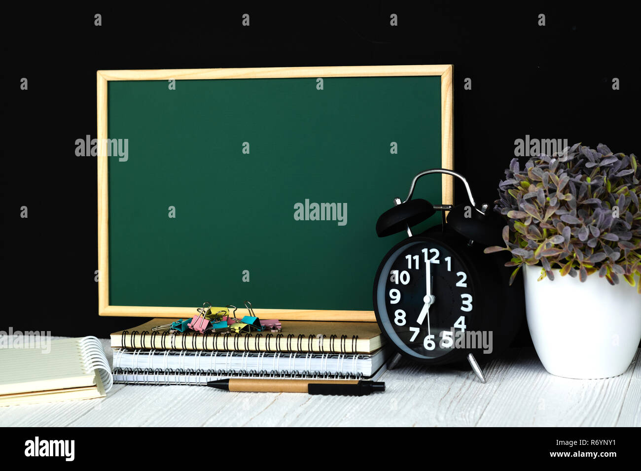 Back to school and education concept idea, green chalkboard with pile ...