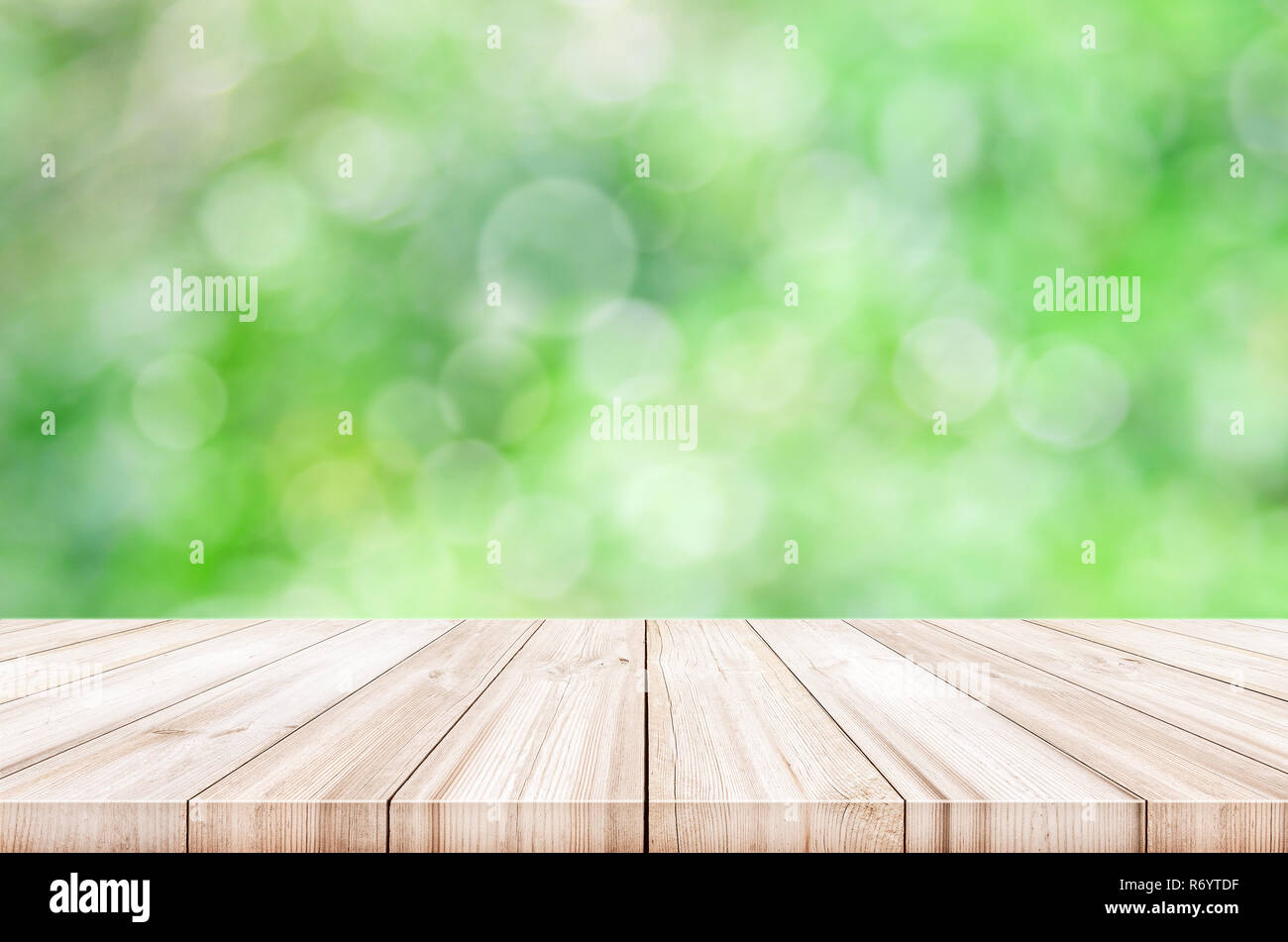 Empty wooden table top with blurred green garden background Stock Photo ...