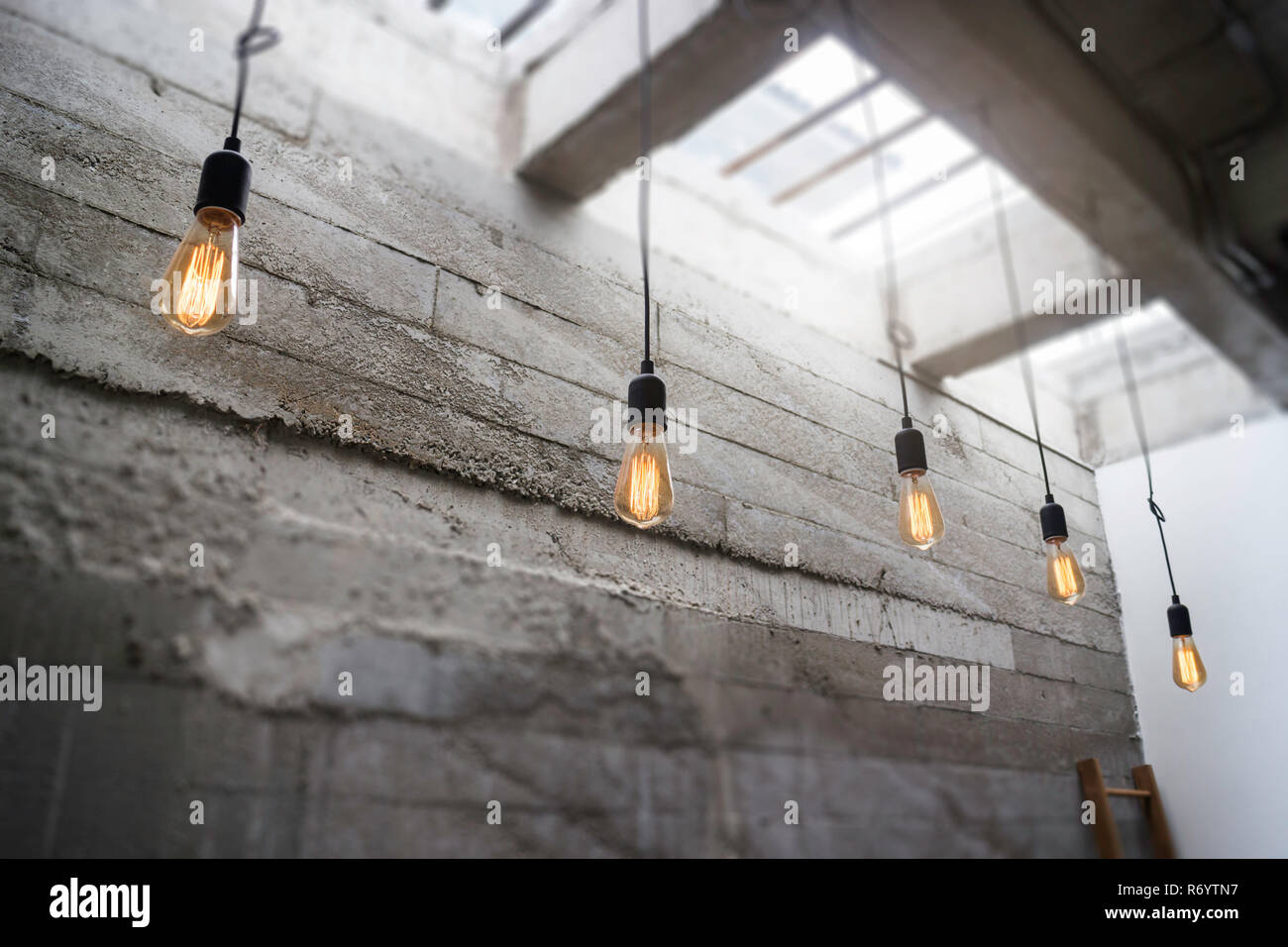 Light bulbs hanging from ceiling Stock Photo Alamy