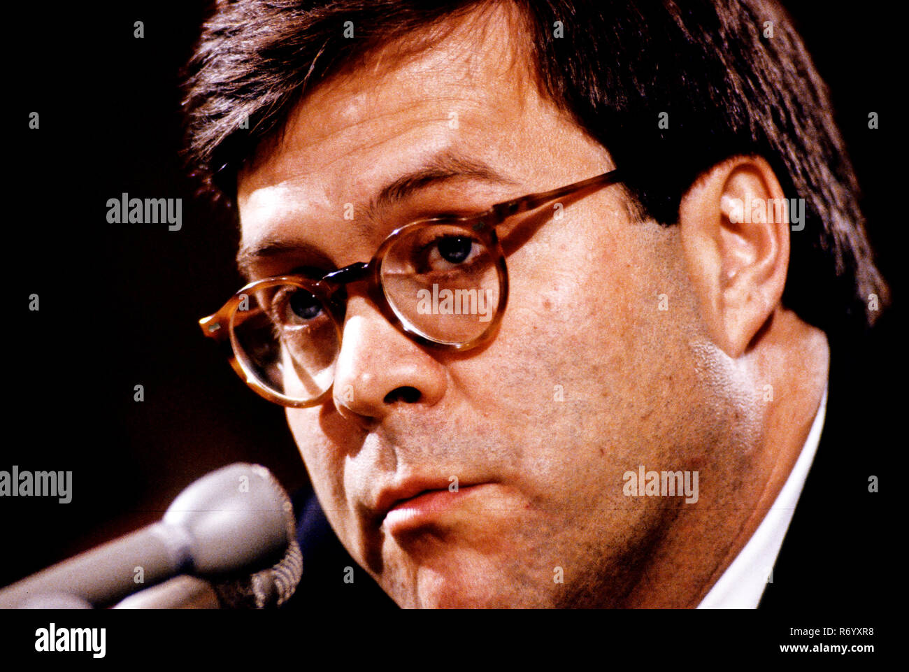 William P. Barr, who was was appointed by United States President George H.W. Bush to be the 77th US Attorney General, testifies before the US Senate Committee on the Judiciary on Capitol Hill in Washington, DC on November 12, 1991. Credit: Ron Sachs / CNP / MediaPunch Stock Photo