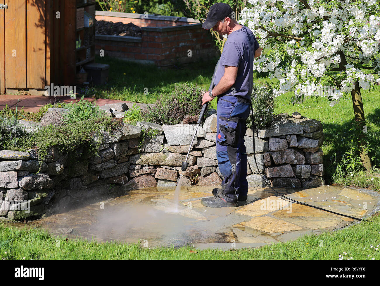 working with the pressure washer Stock Photo Alamy
