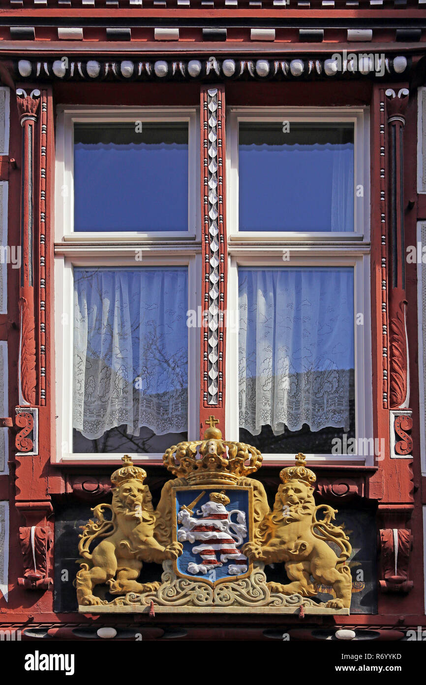 window on half-timbered house in marburg with hessian coat of arms Stock Photo